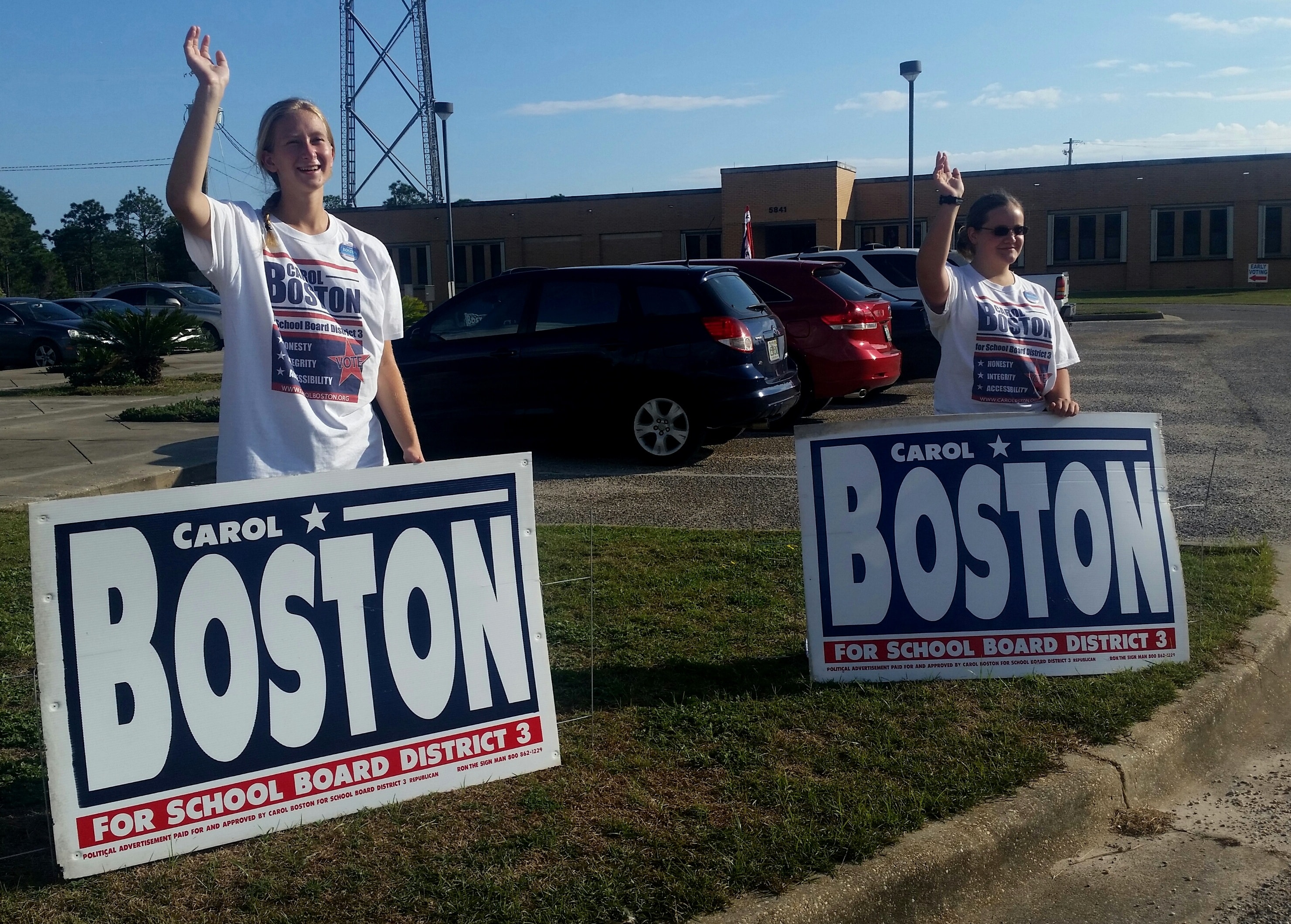 Carol Boston supporters holding campaign signs