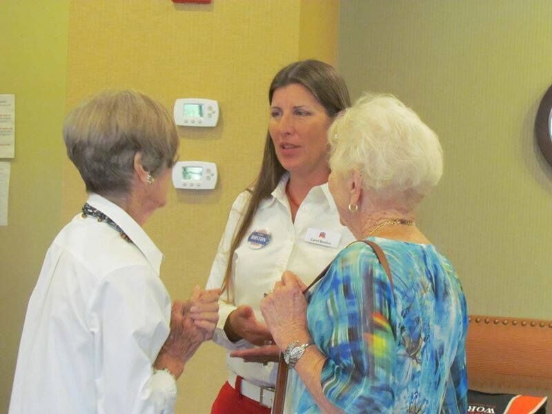 Carol Boston in conversation with community members at an event