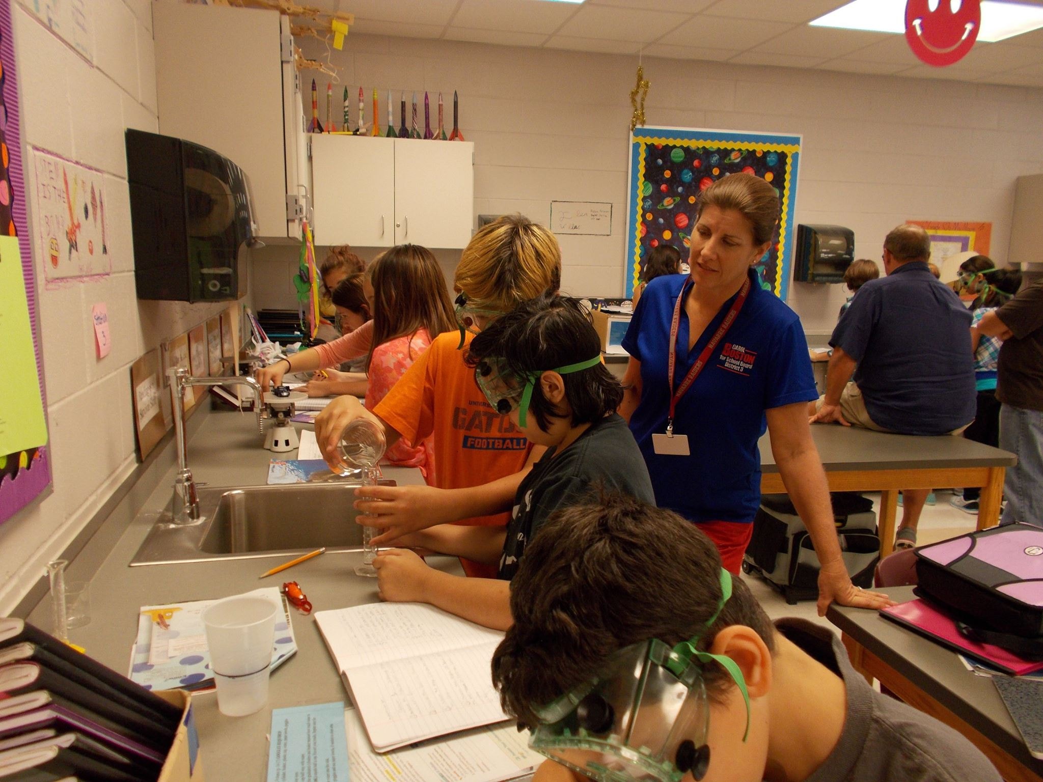 Carol Boston in a science classroom with students